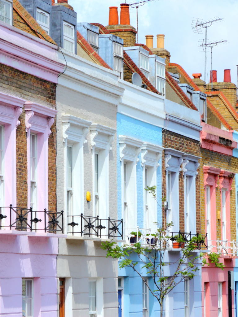 An image of different coloured houses on a street